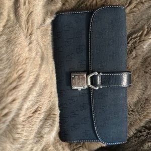 Black logo Dooney & Burke wallet.